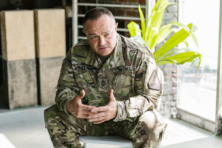 Photo of Man in Brown and Green Camouflage Uniform