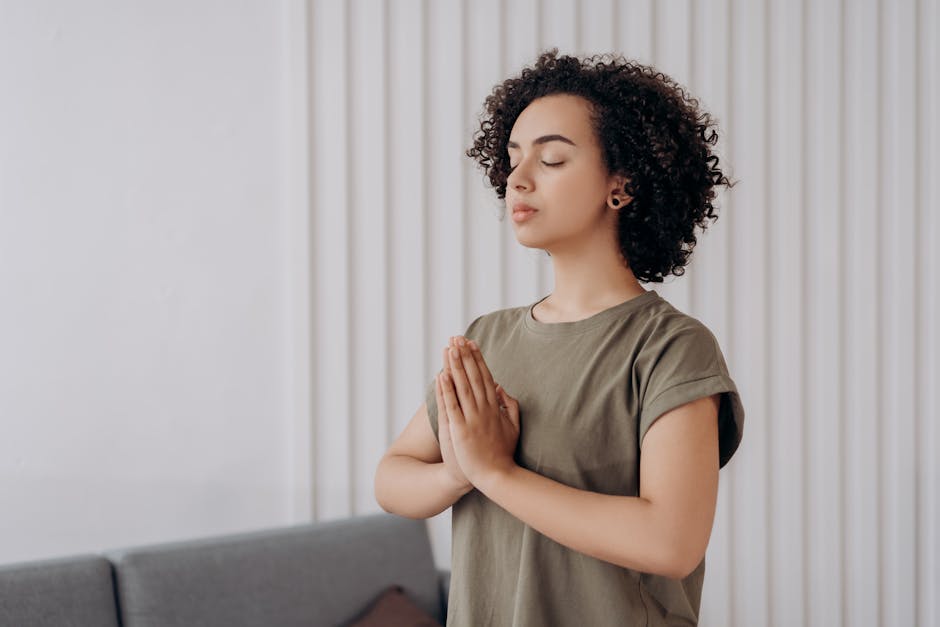 Woman in Gray Crew Neck T-shirt In A Yoga Position