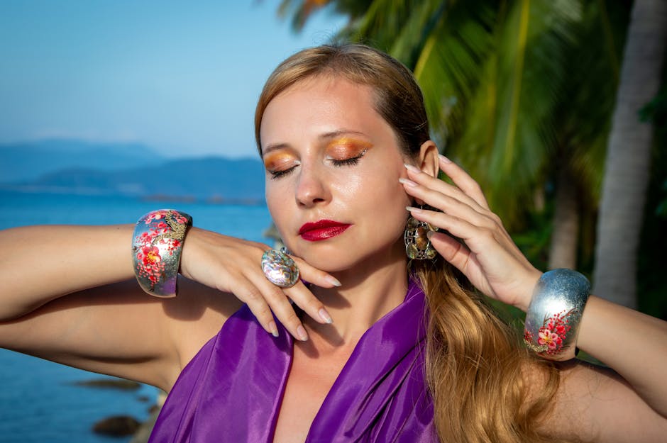 A woman in purple dress with silver jewelry