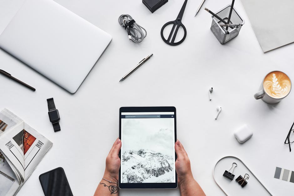 Person Holding Black Ipad