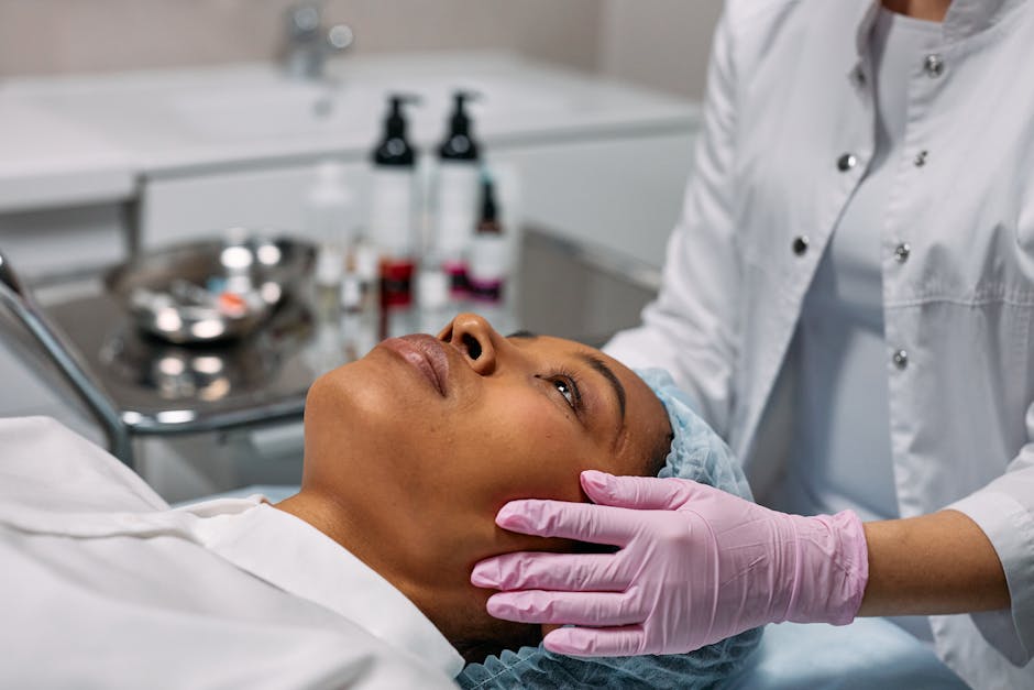 Close Up Photo of Woman Getting Facial Treatment