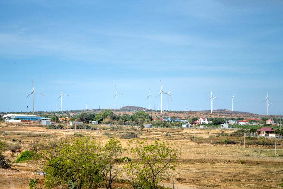 Photo of Wind Turbines Under Blue Sky