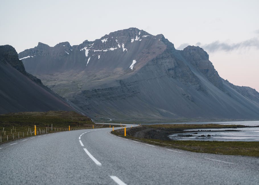 Empty Road Against Mountain Background