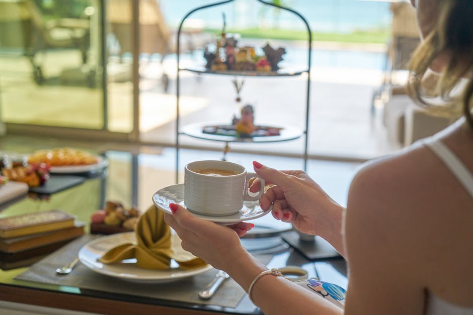 Woman Holding A Cup Of Coffee