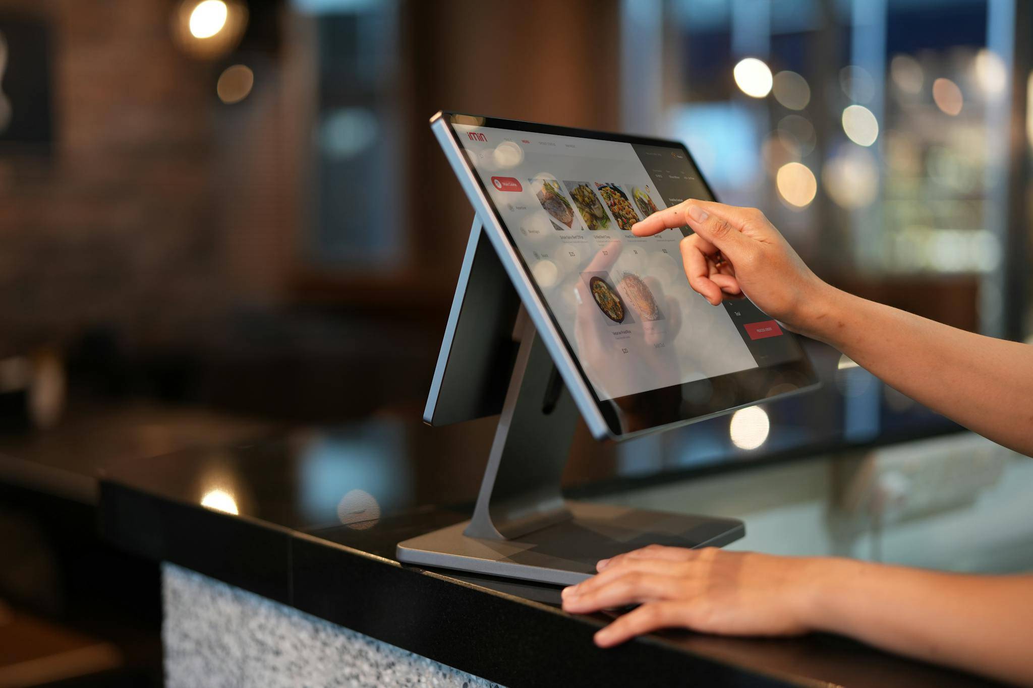 Person Using Macbook Pro on Table