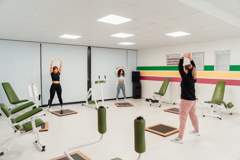 A group of people doing exercises in a gym