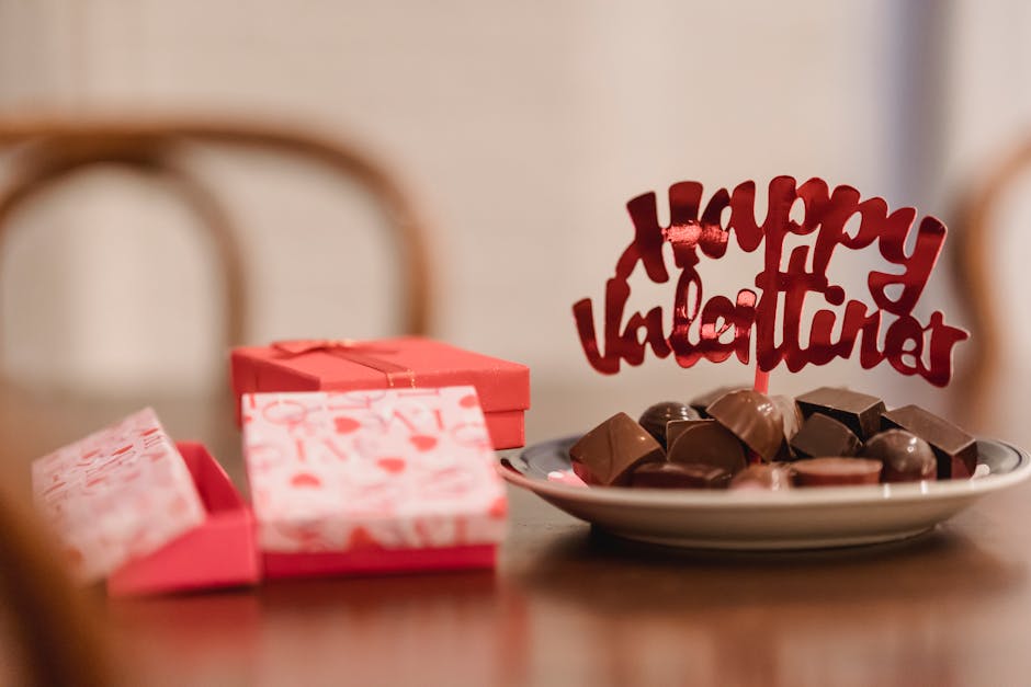 Small gift boxes with chocolates on table