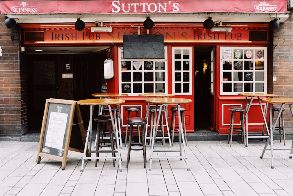 Stylish street cafe with tables and chairs in city