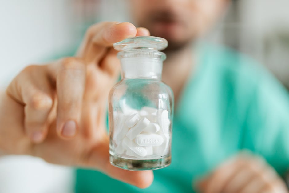 Doctor with vial of drugs in hand