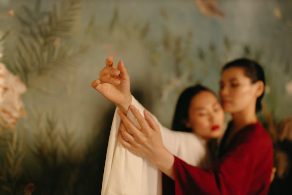 Women in Elegant Gowns Standing Close to Each Other