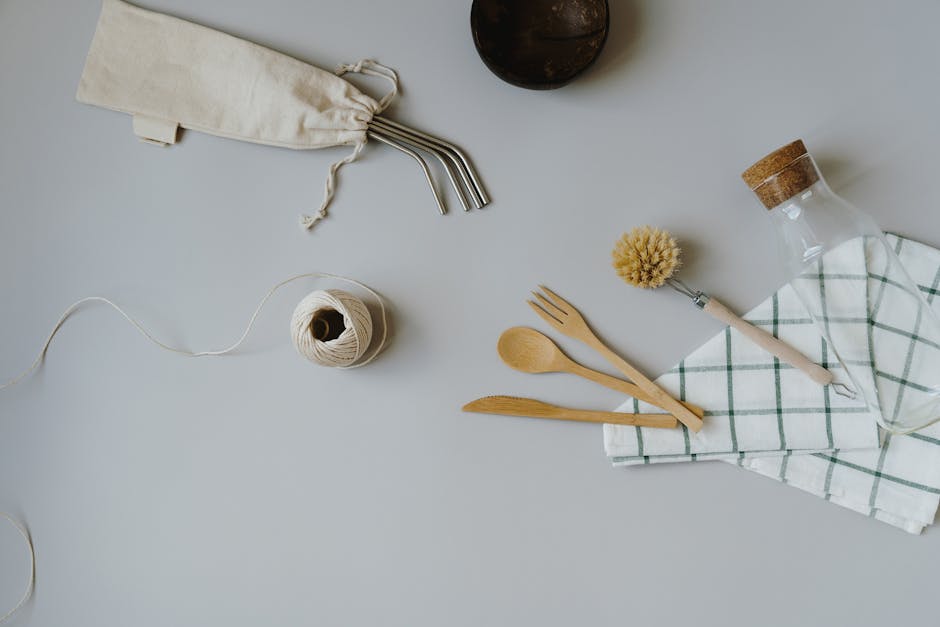 Set of dental tools and cutlery near glass bottle