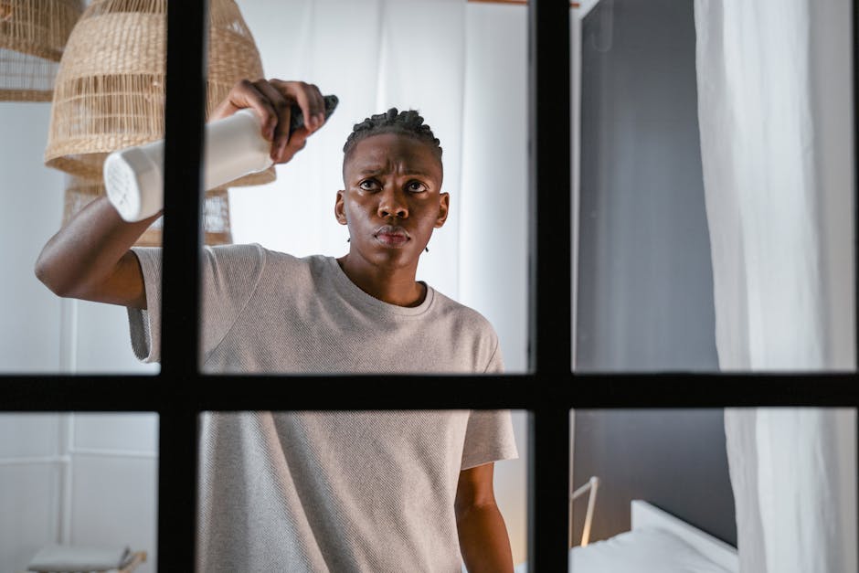 A Man Cleaning the Window