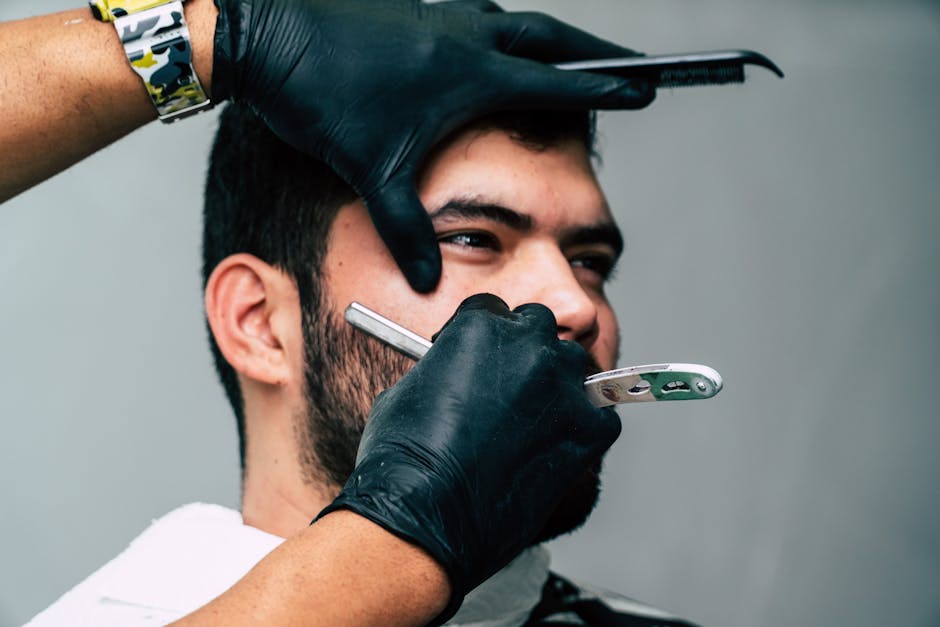 Person Shaving a Man’s Face With Straight Razor