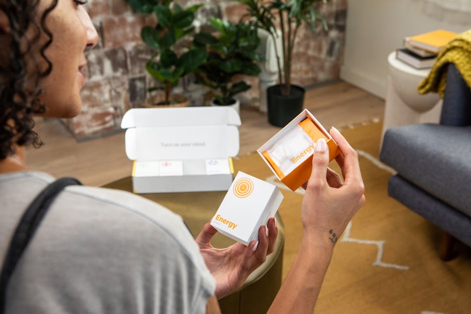 Photo of a Woman Holding a Package with Supplements