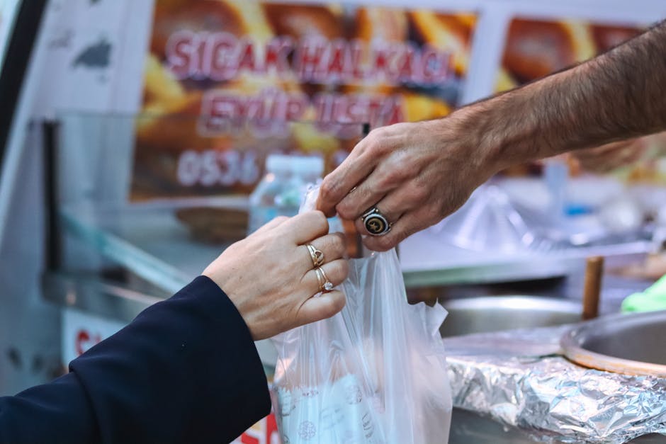 Merchant Giving Customer Plastic Bag