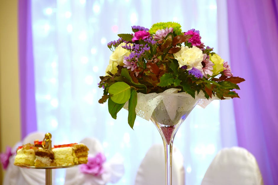 Assorted Flowers Near Purple Curtain