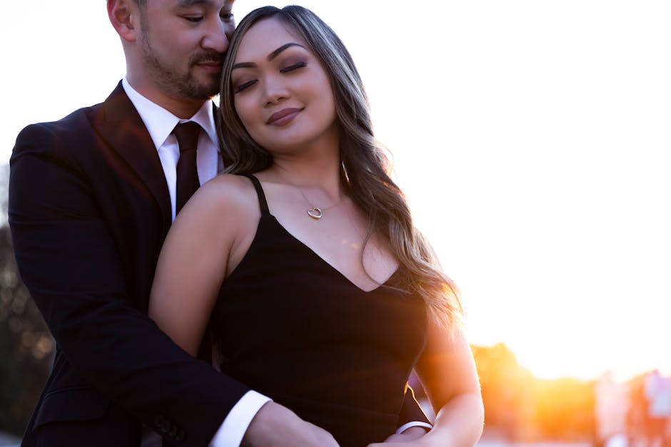 Elegant Couple Embracing at Sunset