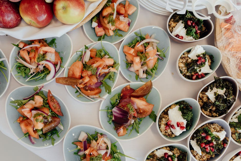 Top view of delicious salads with ripe vegetables prepared for breakfast in daytime