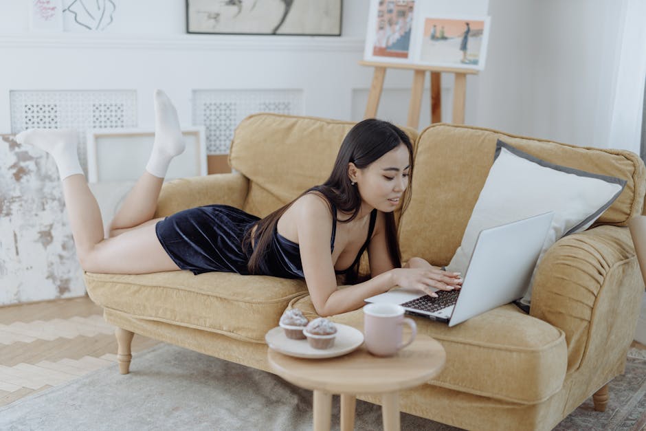 A Woman Browsing on Her Laptop