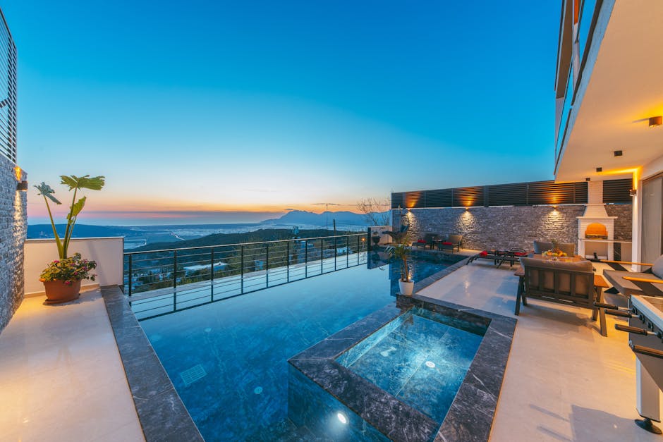 The pool and terrace at sunset with the view of the sea