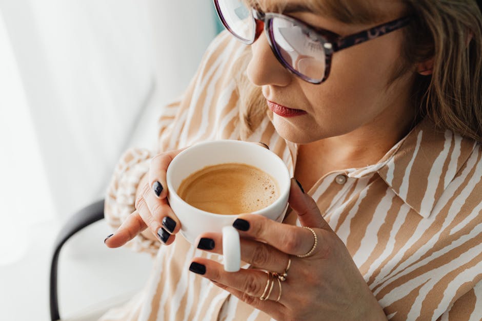 Woman Wearing Eyeglasses Drinking Coffee