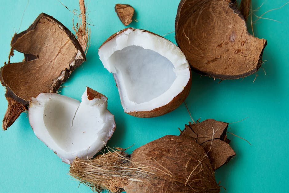 Pieces of cracked coconut with aromatic white pulp