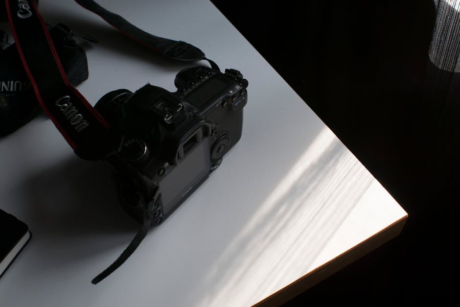 Photo of Canon Dslr Camera on Table