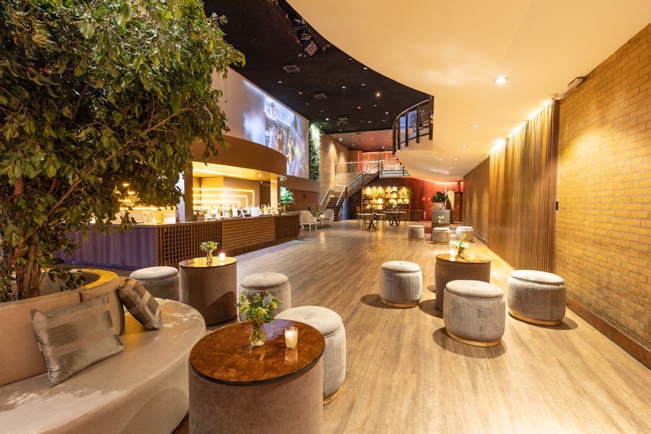 Poufs Set around Tables in Hotel Lobby