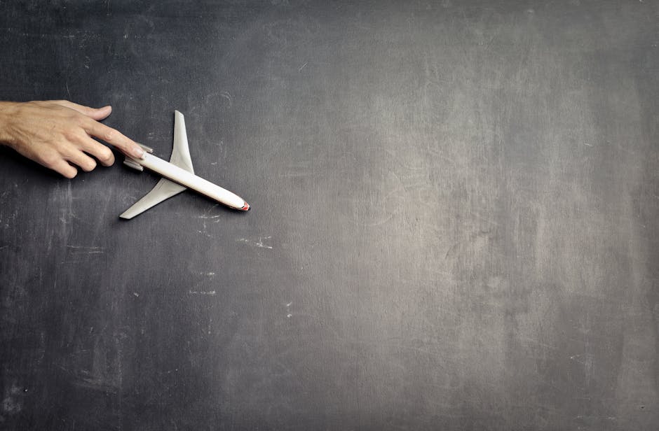 Toy airplane on a blackboard representing international shipping concept