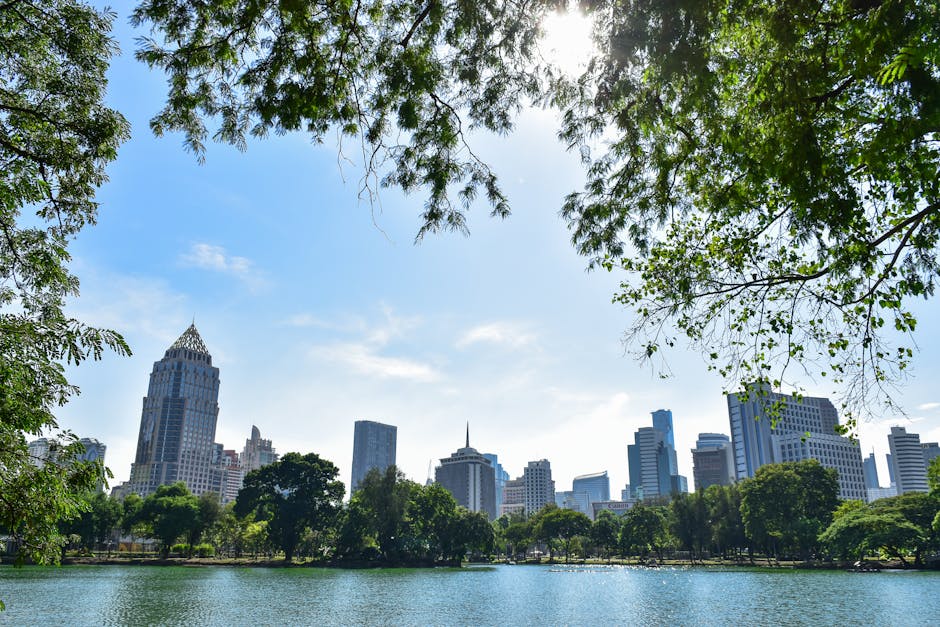 Photo of Body of Water Across City Skyline