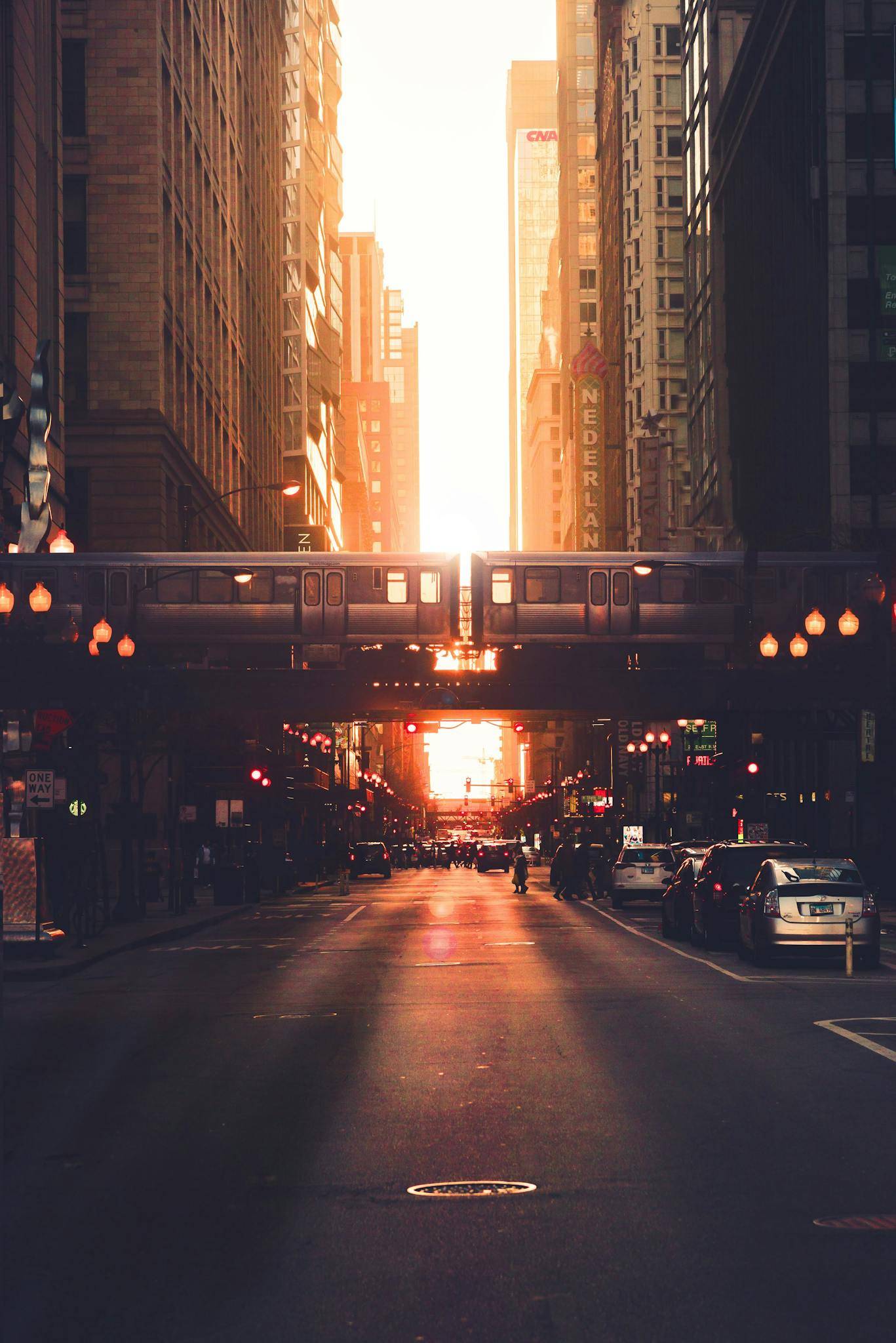 Urban city district with modern high rise architecture and elevated railway in early evening