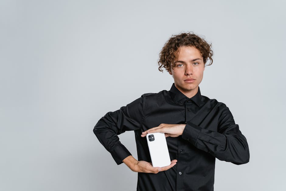 Man in Black Dress Shirt Holding White Paper