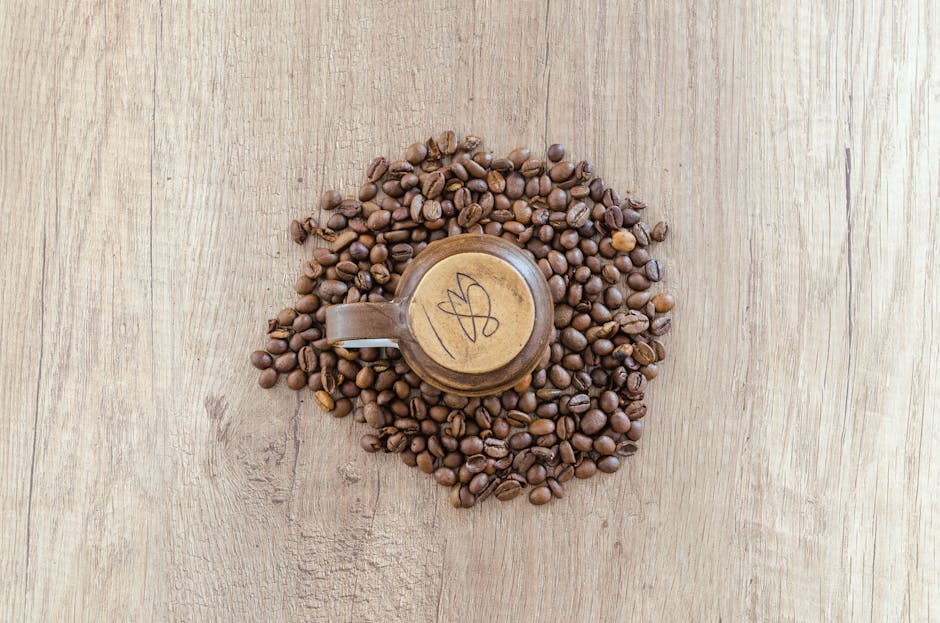 Flat Lay Photography of Mug Surrounded by Coffee Beans