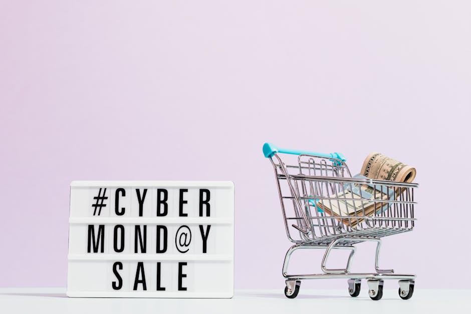TCas Money On A Shopping Cart Beside A Cyber Monday Sale Signext