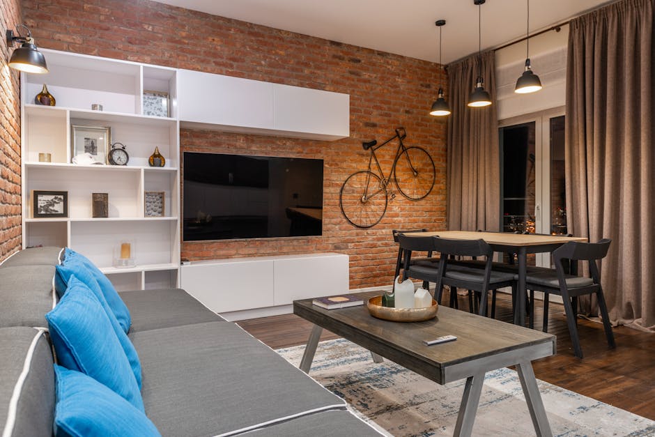 Modern loft room interior with furniture and TV at home