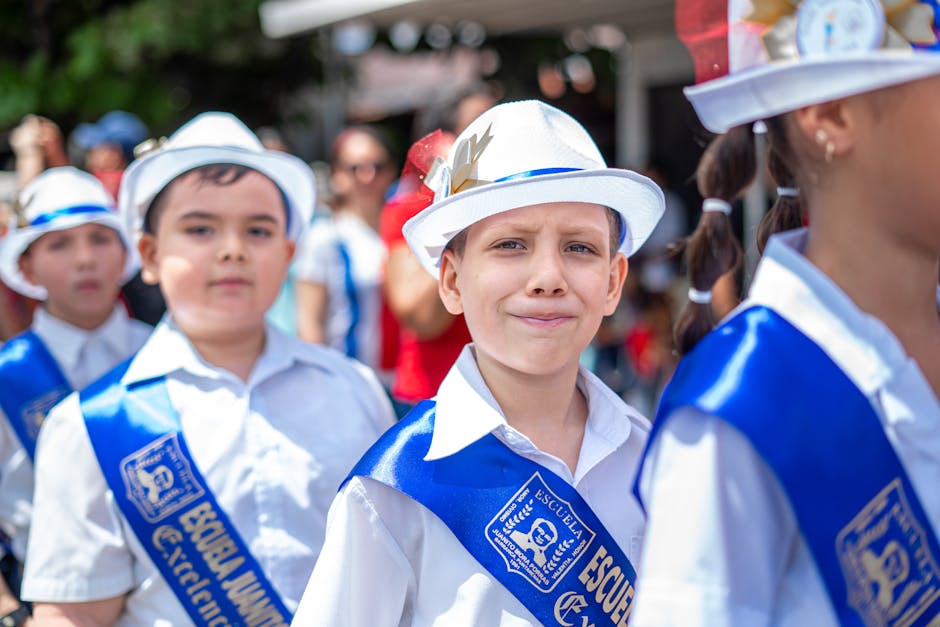 A group of children wearing blue and white hats