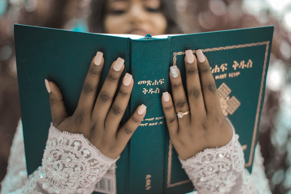 Crop bride reading Bible during wedding ceremony