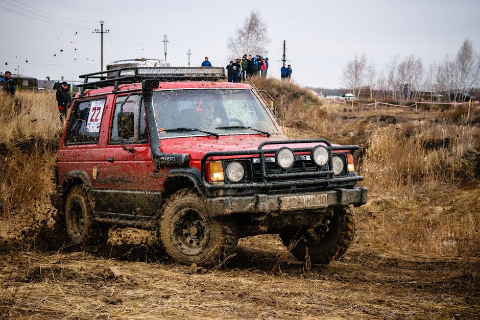 Red Suv on Mud Track