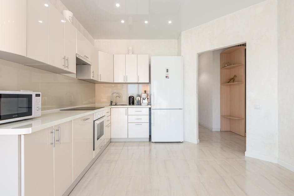 White glossy cabinets in minimalist kitchen