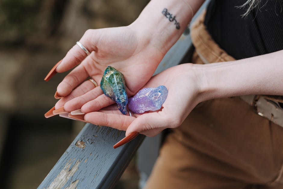 Crop woman showing opals in hands