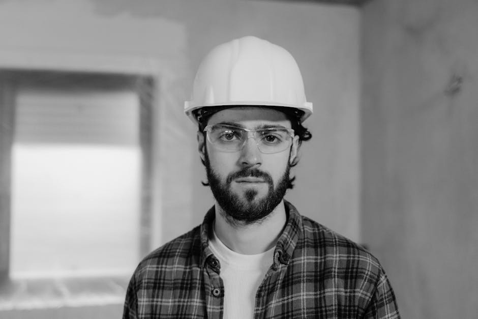 Man in White Hard Hat and Plaid Shirt