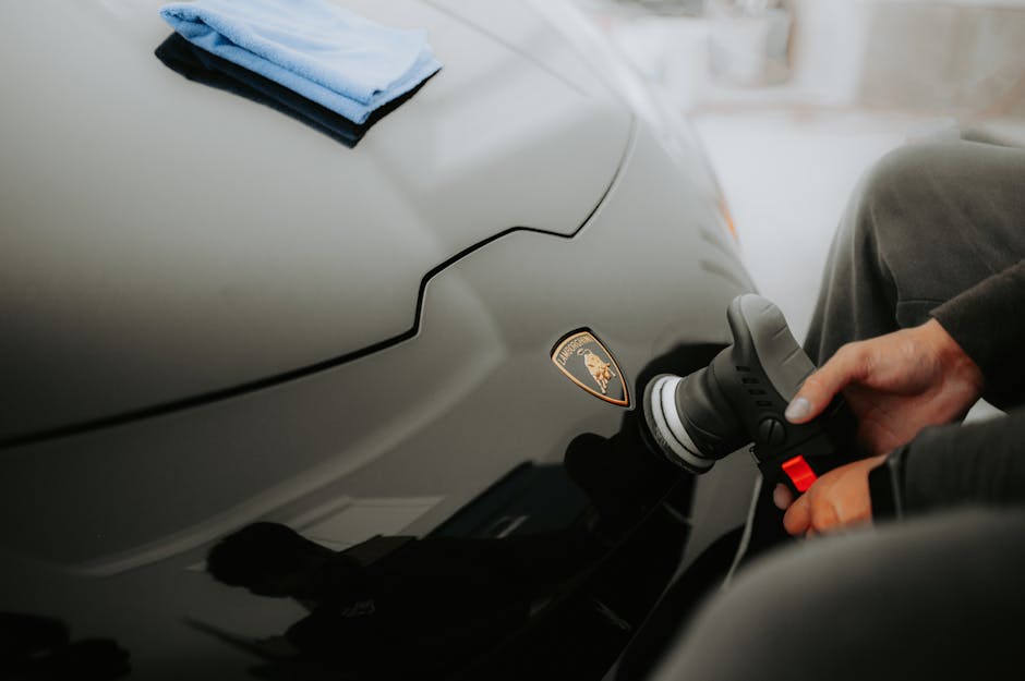 A Person Polishing the Car’s Body