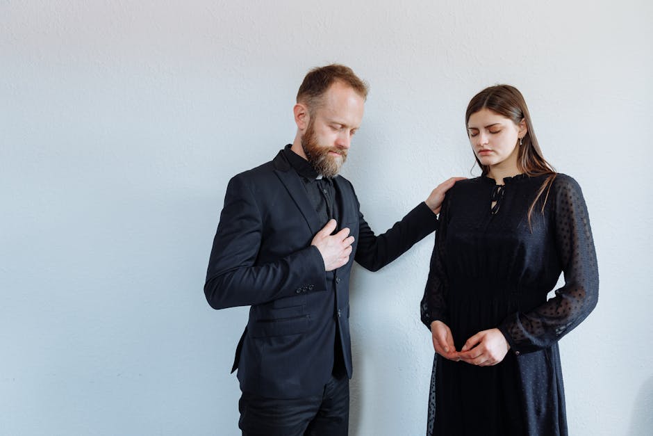 Priest Supporting Woman in Black Dress