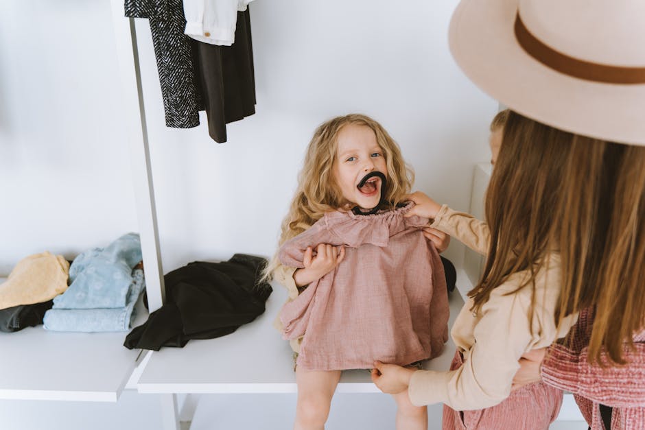 Mother Giving Little Daughter Dress