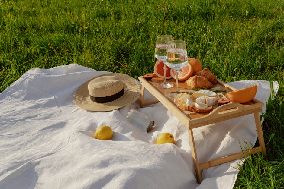 Picnic Table with Food on Blanket