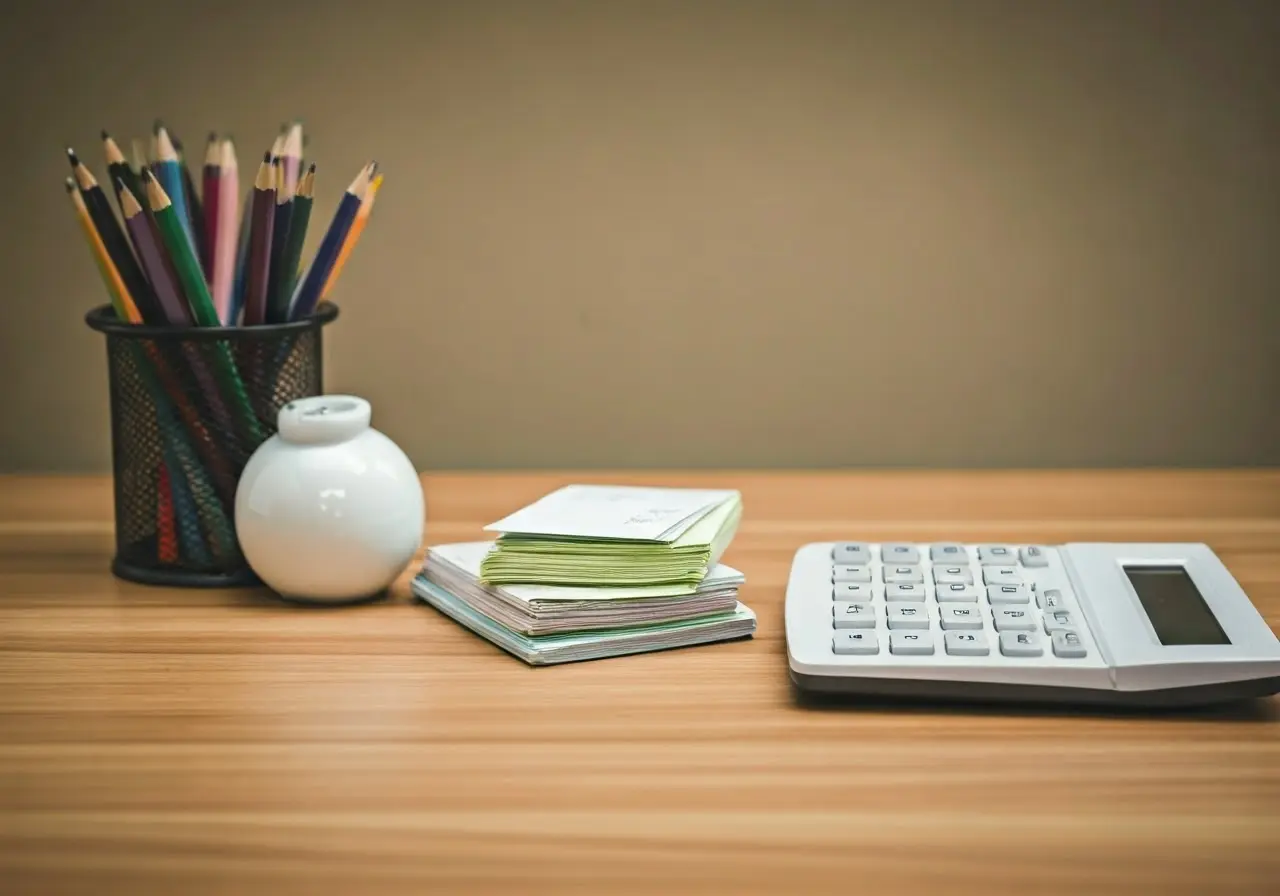 A neat desk with a colorful receipt organizer and calculator. 35mm stock photo