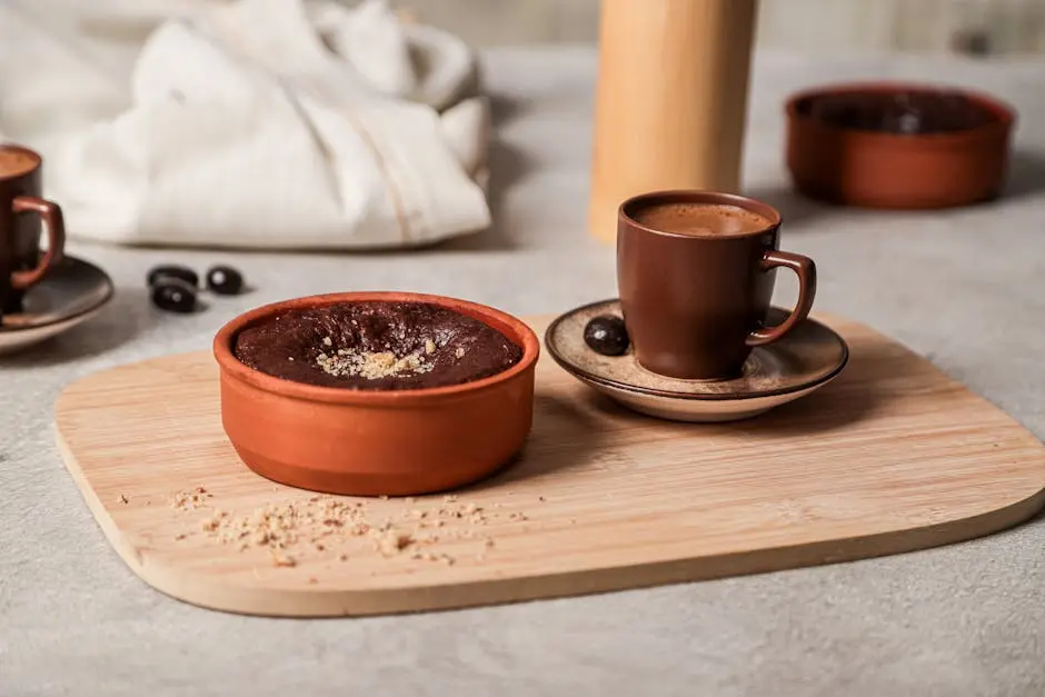 Close-up of a Cup of Coffee and a Dessert in a Bowl