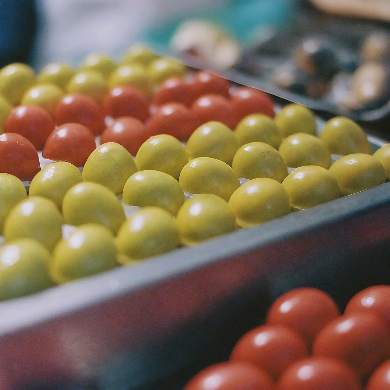 A street food stall selling colorful Hong Kong egglets in Singapore. 35mm stock photo