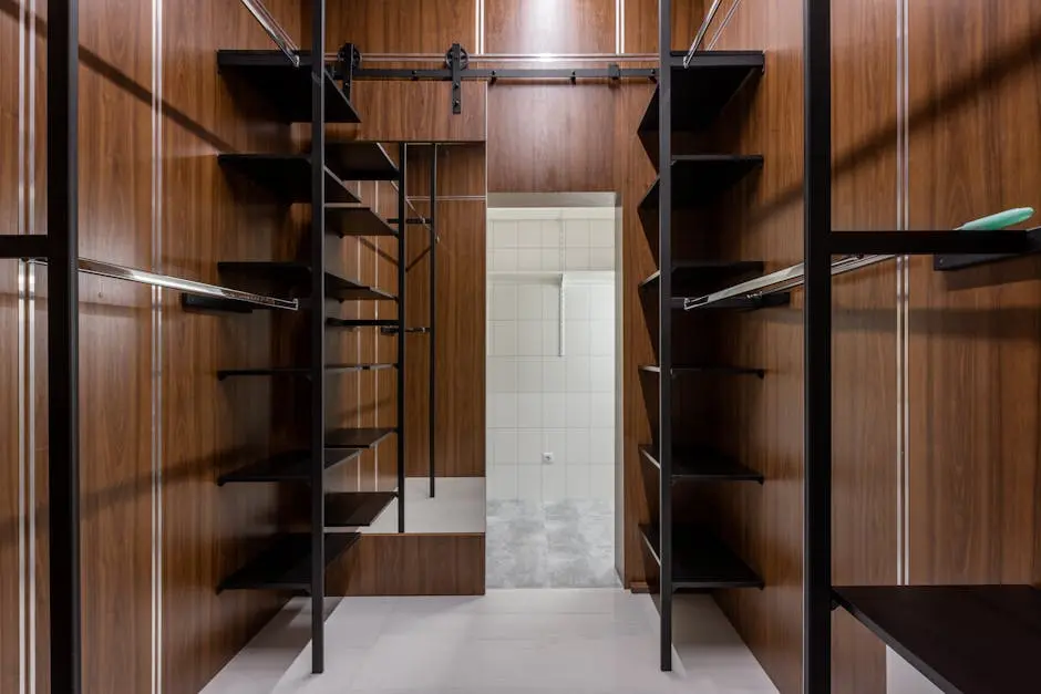 Spacious and modern walk-in closet featuring sleek wooden shelving and a stylish minimalist design.