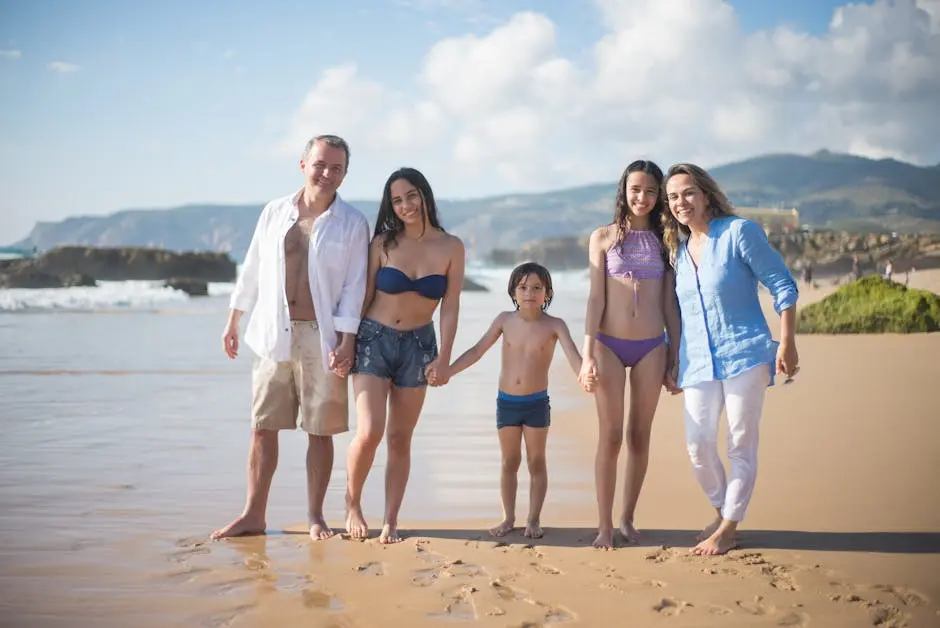 A Family Standing on the Sand with Footprints